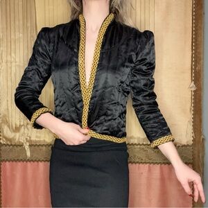Black and Gold Vintage 1980's Jacket.
No tags. Would best fit a size small.